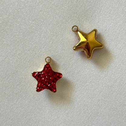 Gold and red gems star charm behind