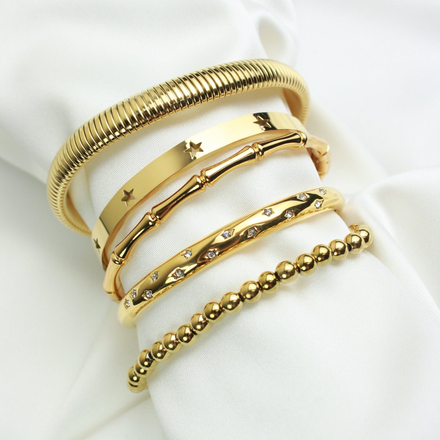 Gold bracelets bangles stack