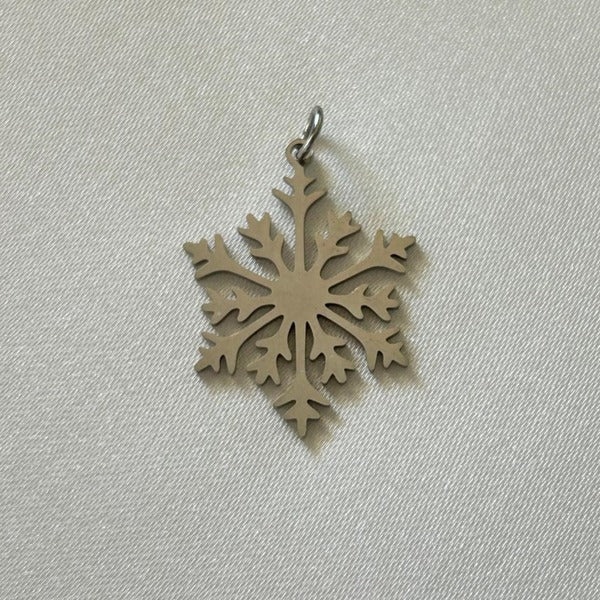 Silver snowflake charm